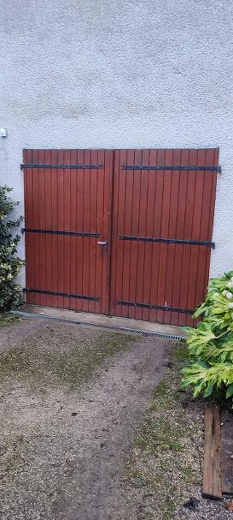 Remplacement d'une porte de garage sectionnelle isolante double paroi Novoferm motorisation Novoporte en pose intérieure à Neuilly-Crimolois
