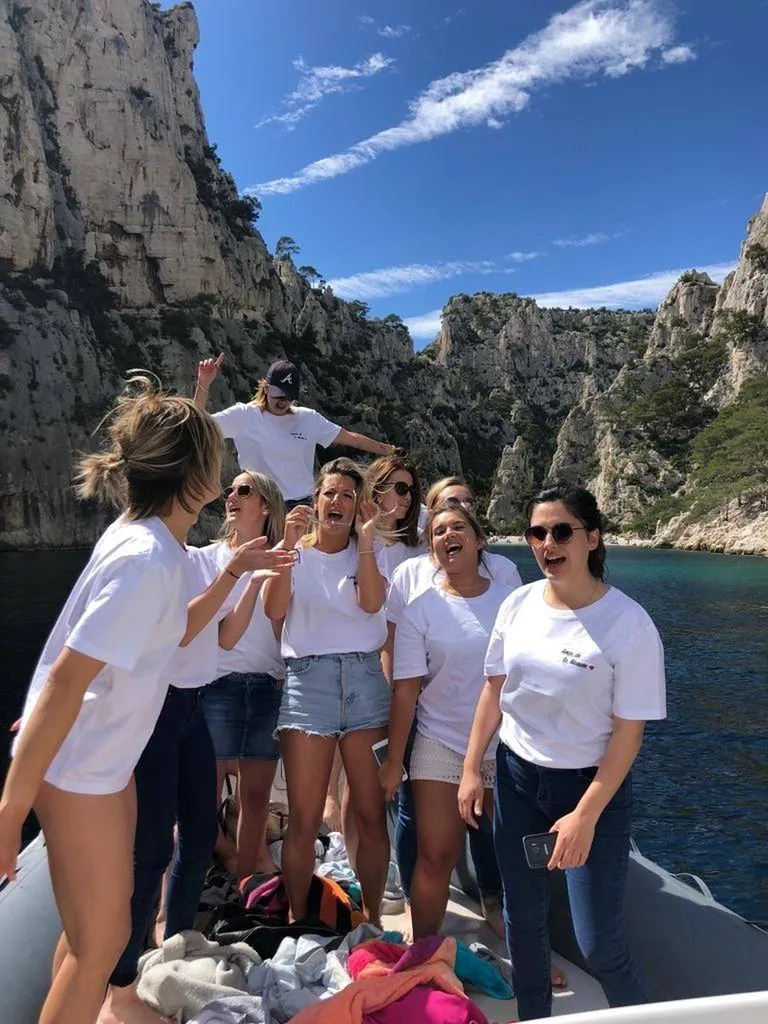 Bride-to-be and her friends swimming in a turquoise cove in the Parc National des Calanques during a hen party with L'Eden Boat
