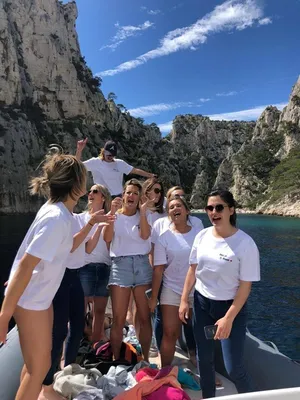 Bride-to-be and her friends swimming in a turquoise cove in the Parc National des Calanques during a hen party with L'Eden Boat