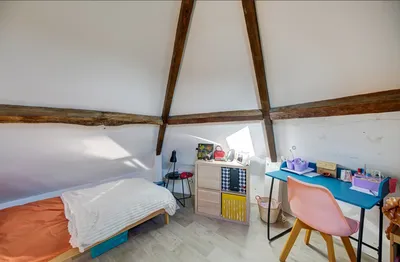chambre enfant sous les toits par Helix immobilier Le Vésinet