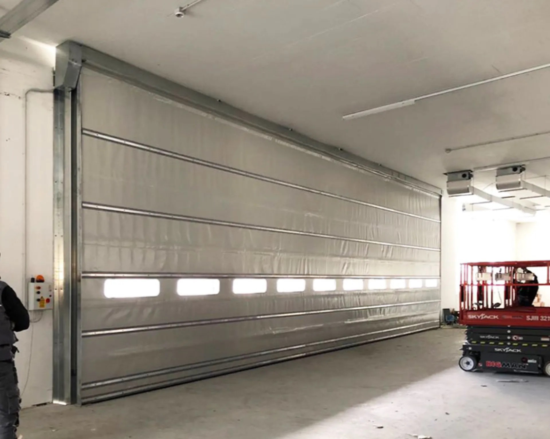 porte rapide empilement isolation thermique et acoustique