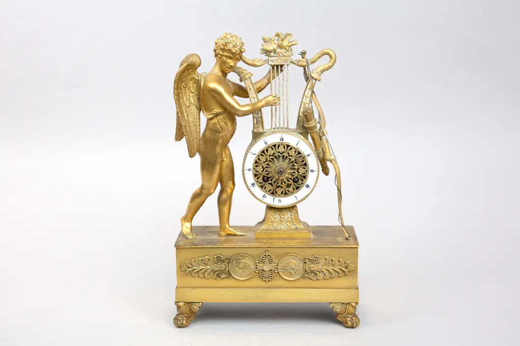 Pendule Epoque Restauration en bronze doré