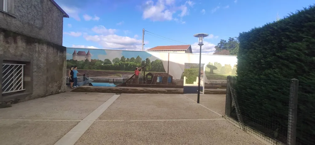 Fresque artistique sur mur maçonné patrimoine culturel neuvic sur l'isle