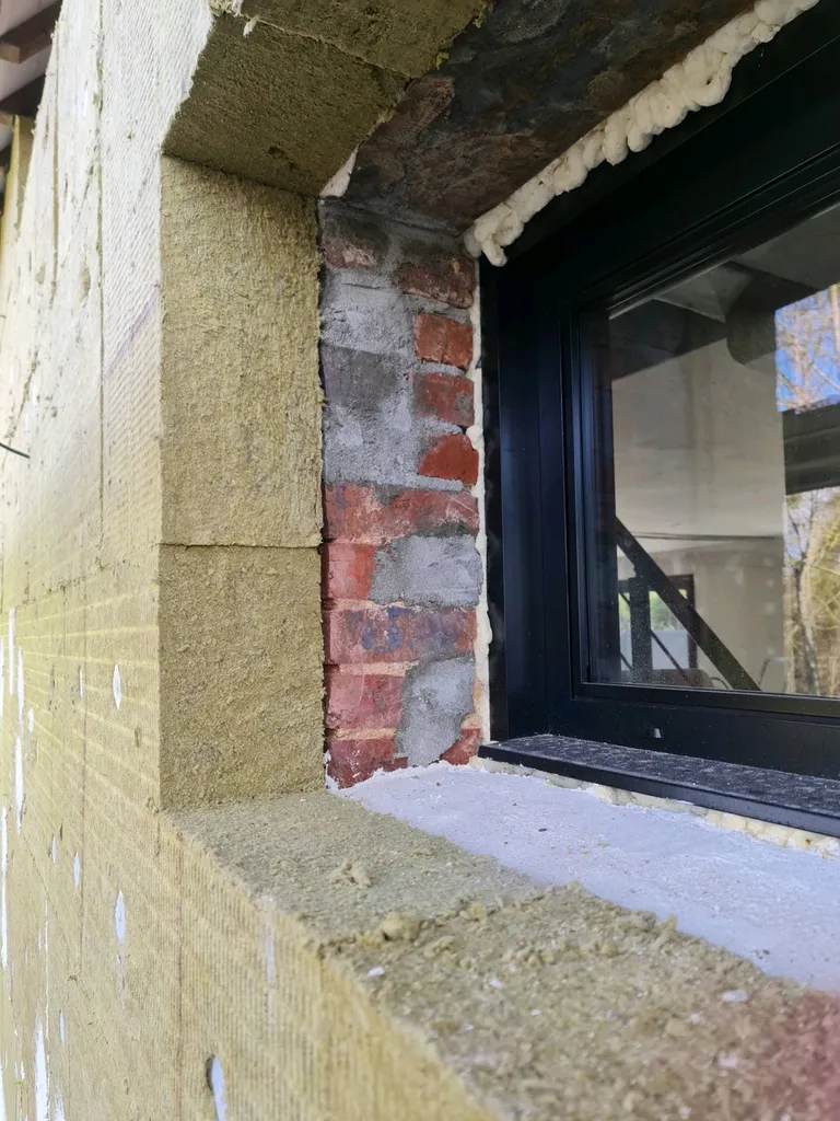 Isolation par l'extérieur des murs d'une maison en laine de roche