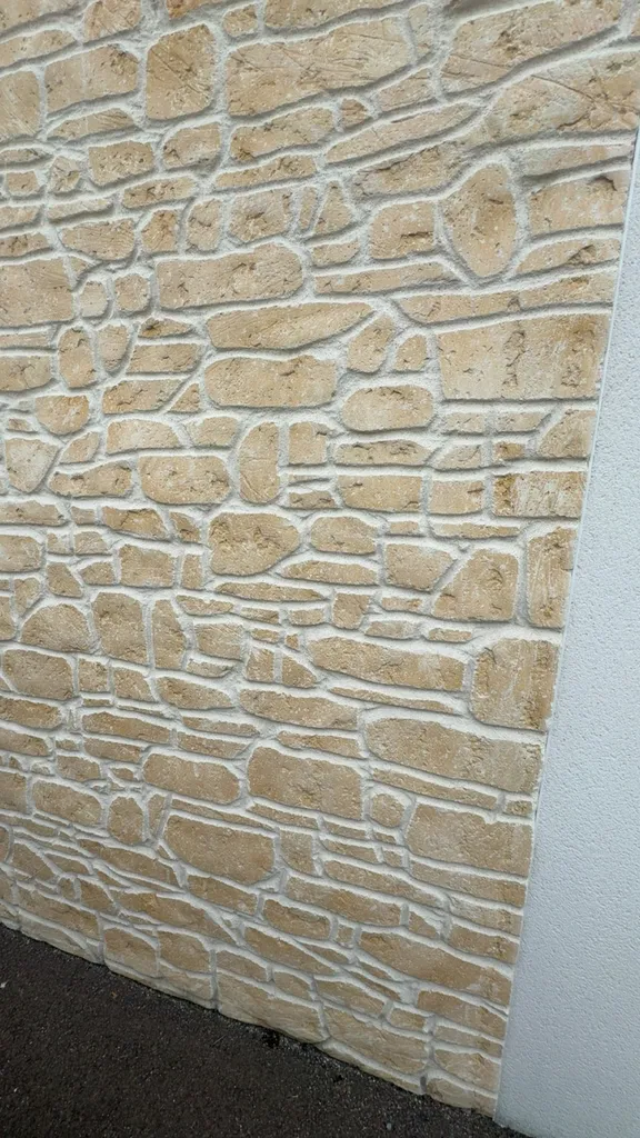 Réaliser un enduit aspect pierre sur une façade de maison à Le Havre 76